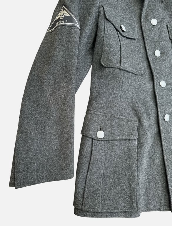 DRK (Deutsches Rotes Kreuz)  Vorhelfer service tunic with original insignia and armband.