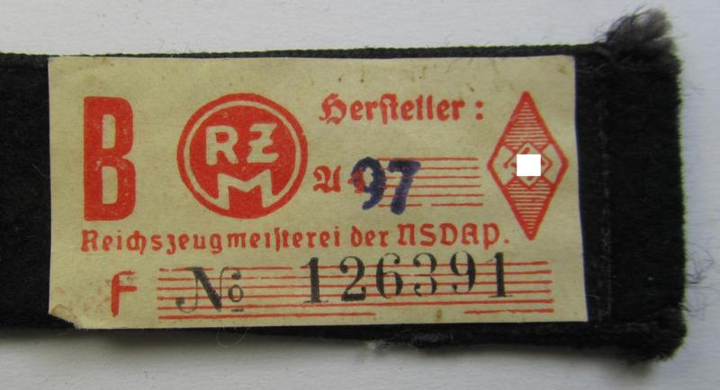 Neat - and naturally single! - black-piped, so-called: 'DJ- o. Deutsches Jungvolk' shoulderstrap as was intended for usage by a: 'DJ-Mitglied' who served within the: 'Bann 565' (565 = 'Spittal') and that comes with its 'RzM'-etiket