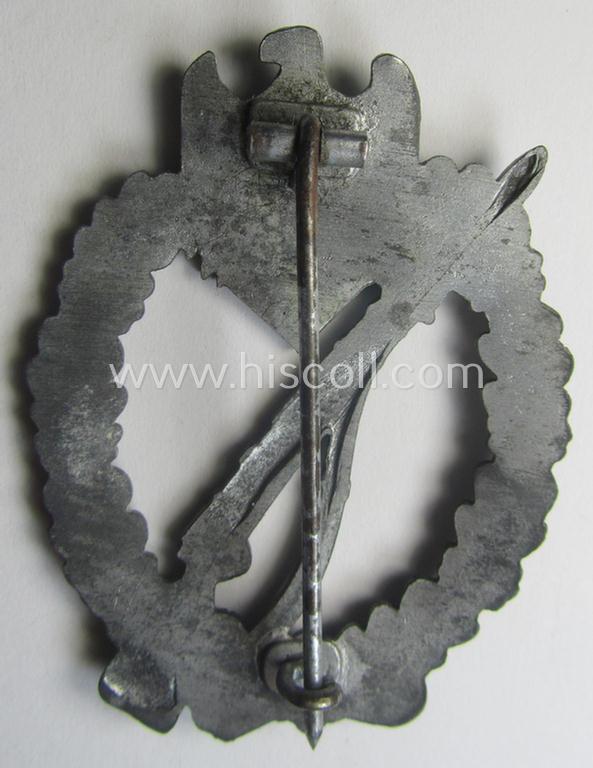 'Infanterie Sturmabzeichen in Silber' being a non-maker-marked and/or typical zinc- (ie. 'Feinzink'-) based version (ie. 'crimped scooped rifle-variant') as was (I deem) procuded by the: 'S&L'- (ie. 'Steinhauer u. Lück'-) company
