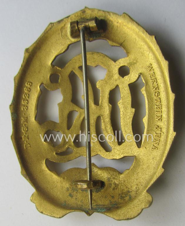 'Virtually mint' - and truly rarely found! - example of a: 'Reichssportabzeichen DRL in Gold' (or: DRL sports'-badge in gold) being a just moderately worn- ie. used example that is nicely maker- (ie. 'Wernstein - Jena'-) marked on its back