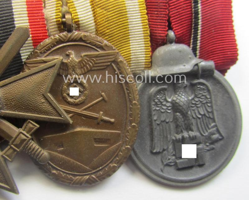 4-pieced, WWII-period medal-bar (ie. 'Ordenspange') showing resp. an: 'EKII.Kl.', a: 'KvKII.Kl. m. Schw.', a: 'Westwall'-medal and a: 'Medaille Winterschlacht im Osten 1941-42'
