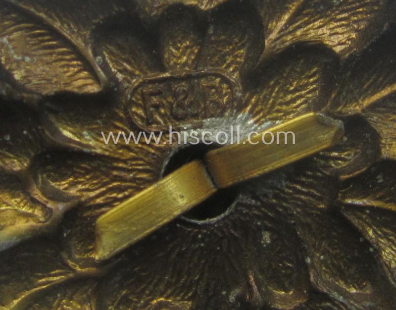 WH (Heeres) (bright) silverish- (ie. golden-) coloured, zinc-based (and neatly maker- ie. 'F&B'-marked) so-called: 'M43'-pattern 'Edelweiss'-cap-badge (ie. 'Mützenabzeichen')