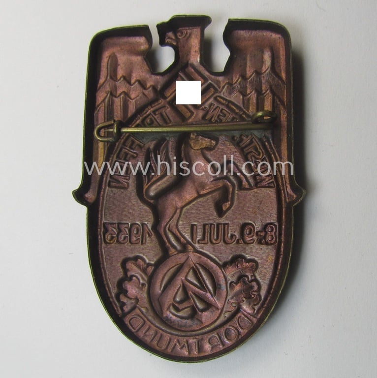 Commemorative, golden-bronze-coloured N.S.D.A.P.- (ie. 'SA- o. Sturmabteilungen'-) related 'tinnie' being a non-maker-marked example showing a detailed eagle-device, SA-logo- and text: 'Westfalentreffen - Dortmund - 8.9. Juli 1933'