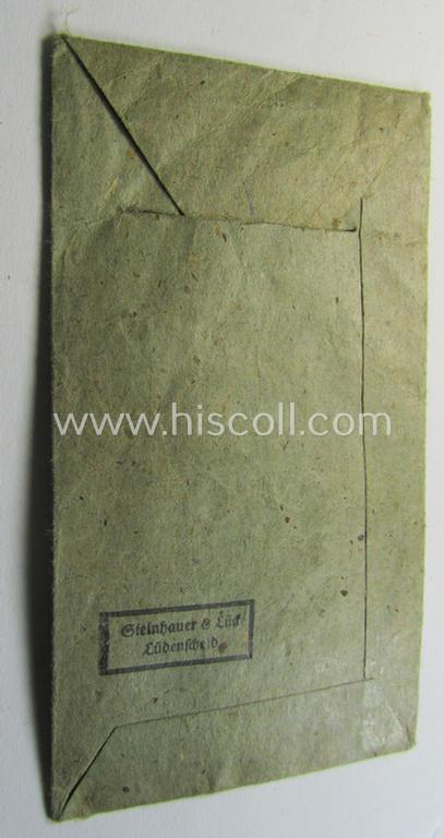 Attractive, silver-class wound-badge (or: 'Verwundeten-Abzeichen in Siber') being a non-maker-marked example that comes stored in its original, carton-based pouch as was produced by the maker (ie. 'Hersteller'): 'Steinhauer & Lück'