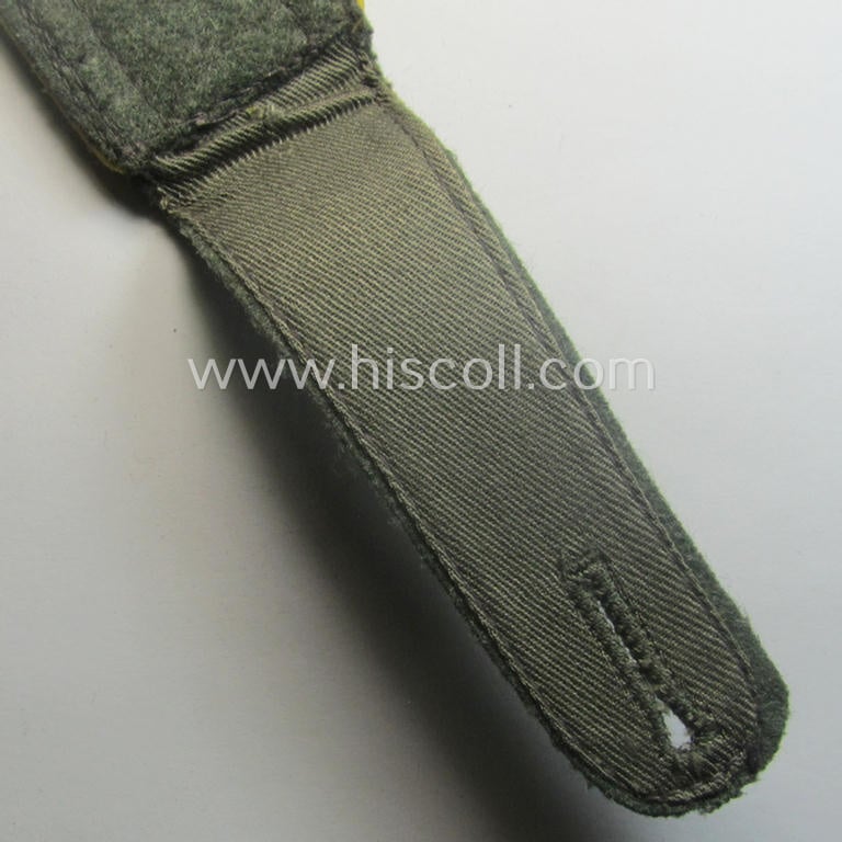 Single, mid-war-period, so-called: 'M43'-pattern, WH (Heeres) NCO-type shoulderstrap as piped in the bright-yellow-coloured branchcolour as was intended for usage by an: 'Uffz. der Nachrichten-Trpn.'