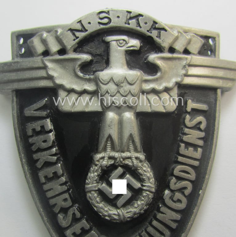 Superb - quite rarely seen and very detailed! - aluminium-based, N.S.K.K.-related armshield (ie. 'Ärmelshield') depicting the typical N.S.K.K.-eagle-device and text that reads: 'Verkehrserziehungsdienst'
