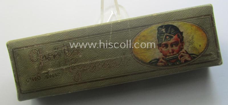 TR-era- (ie. 'Deutsche Wehrmacht'-) related harmonica entitled: 'Grüsse aus der Heimat' that came stored in its original and/or carton-based box ie. etui