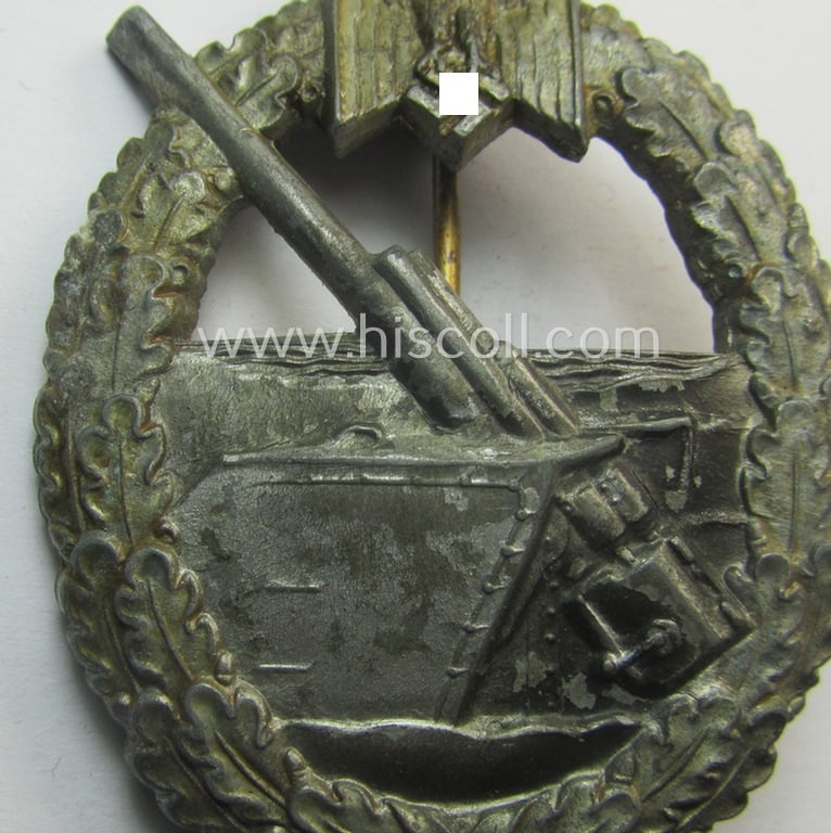 WH (KM) 'Marine-Artillerie-Abzeichen' being a maker- (ie. 'H.A.'-) marked- and/or typical zinc- (ie. 'Feinzink'-) based example by the: 'Hermann Aurich'-company