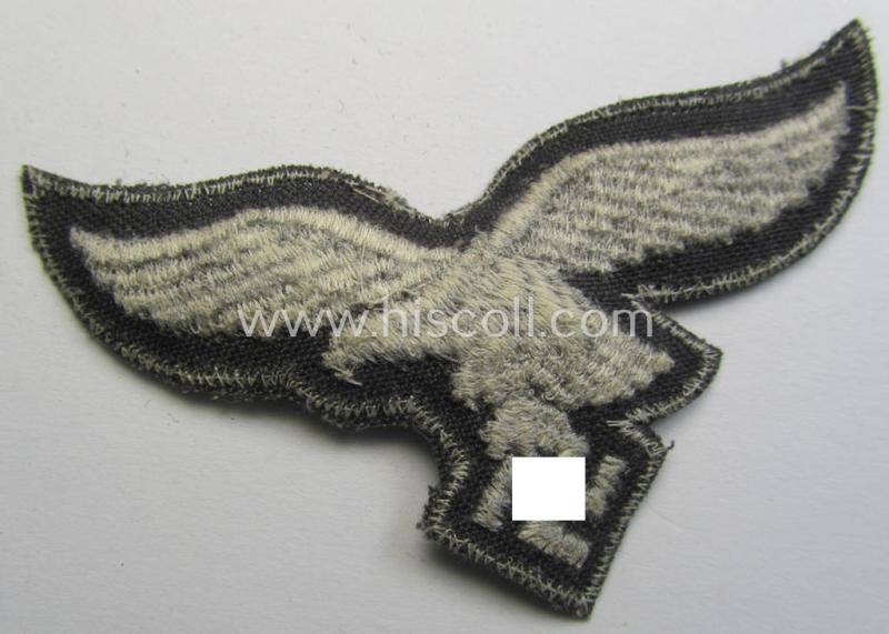 Superb, 'variant'-pattern WH (Luftwaffe) EM- (ie. eventually NCO-) type side-cap eagle (being a 'virtually mint- ie. unissued' example as executed in typical machine-embroidered-pattern onto an unusally seen 'thin-shaped'-background)