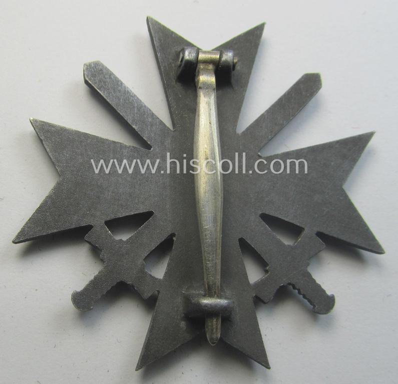 'Kriegsverdienstkreuz 1. Klasse mit Schwertern' being a non-maker-marked specimen by a (by me) unidentified maker as executed in silverish-grey-coloured and/or typical zinc-based metal (ie. 'Feinzink')