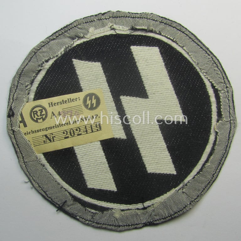Waffen-SS sport-shirt emblem as executed in the neat 'BeVo'-weave pattern that still retains its period-attached 'RzM'-etiket and that comes in an overall very nice- (ie. 'virtually mint'-), condition