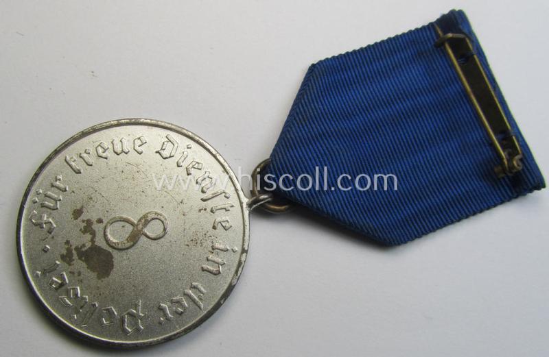 Attractive, bright-silver-toned so-called: 'Polizei-Dienstauszeichnung der 3. Stufe' (or: police loyal service medal of the 3rd class as was awarded for 8 years of service) that comes mounted on its period ribbon (ie. 'Bandabschnitt') as issued