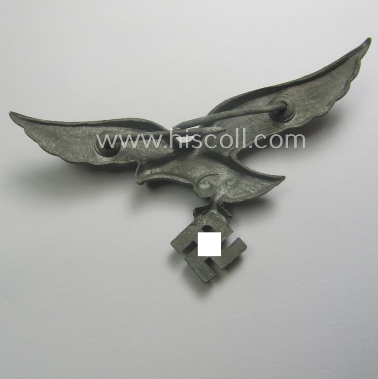 Never worn, WH (Luftwaffe) EM/NCO-pattern visor- (ie. 'Schirmmützen'-) cap-eagle being a non-maker- marked example as executed in zinc-based metal