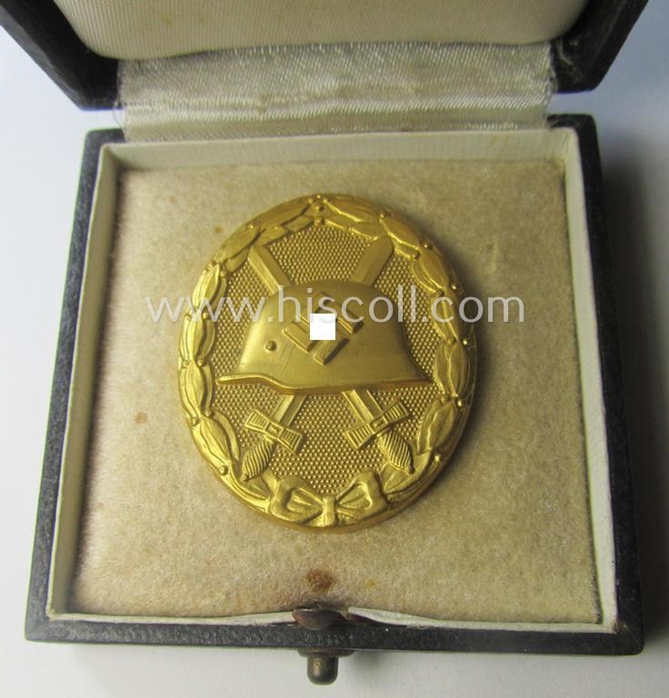 'Verwundeten-Abzeichen in Gold' being a maker- (ie. '30'-) marked- and typical 'Buntmetall'-based example that comes stored in period etui as issued