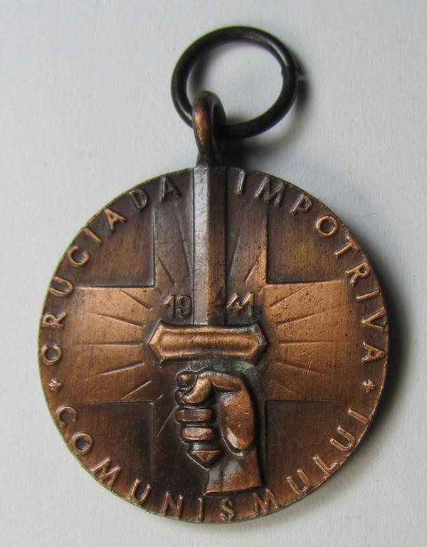 Romanian medal: 'Kreuzzug gegen den Kommunismus' (or in Romanian language: 'Medalia - Crusiada Impotriva Communismului') that comes together with its original (and never confectioned- ie. 'virtually mint') ribbon as issued