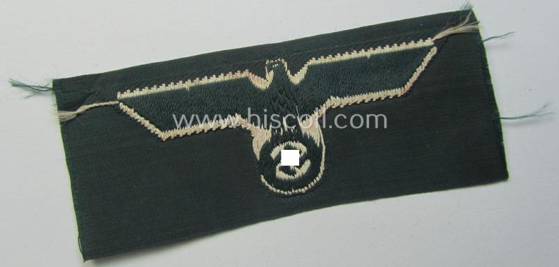 WH (Heeres) pre- (ie. early-) war-period- and/or white-coloured WH (Heeres) type side-cap-eagle as executed in the neat 'BeVo'-weave pattern onto a darker-green-coloured background