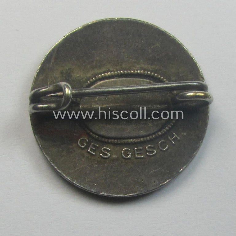 Smaller-sized, early-pattern 'N.S.D.A.P. - Parteiabzeichen' (being a just moderately used 'Ges.Gesch.'-marked example that void of a makers'-designation)