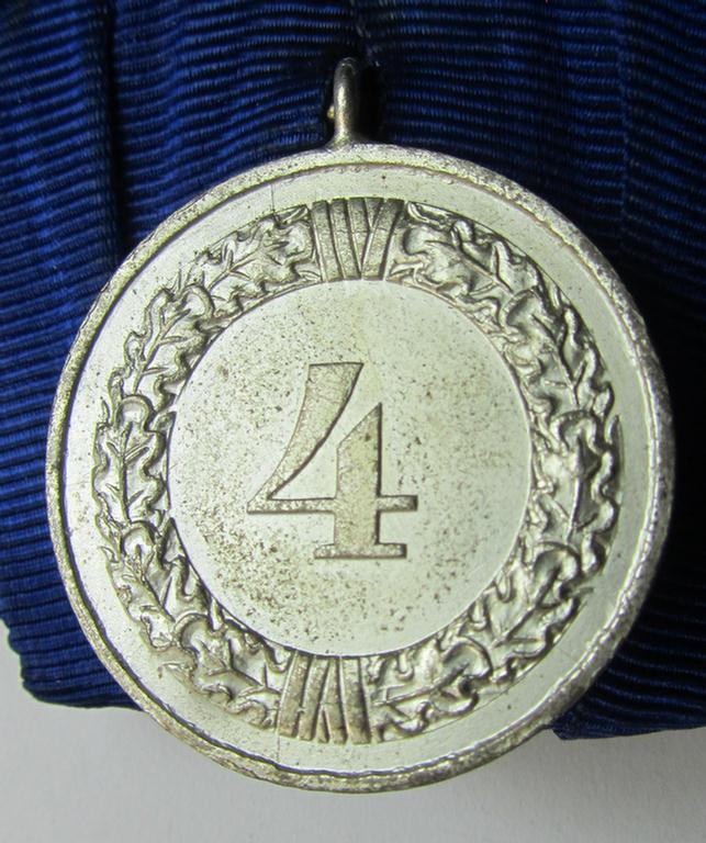 Attractive, silver-toned WH (Heeres o. KM) so-called: 'Einzelspange' showing a: 'WH-Dienstauszeichnung 4. Stufe' (as was intended for 4 years of loyal-service) and that shows a detailed, Heeres o. KM-type-eagle-device, period-attached