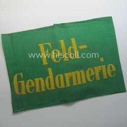 Wehrmacht-related, bright-green-coloured and/or linnen-based armband entitled: 'Feldgendarmerie' (as...