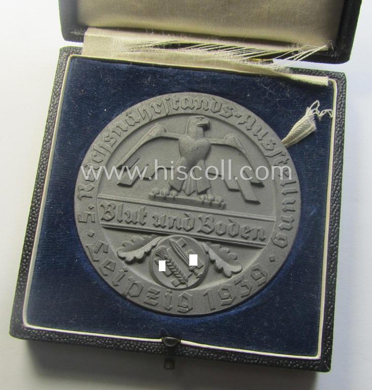 Greyish-silver-toned, 'Reichsnährstand'- (ie. 'RNSt.'-) related, commemorative-award-plaque entitled: 'Reichsnährstands-Austellung - Blut und Boden - Leipzig 1939 - erhitzte Milch' and that comes stored in its period etui