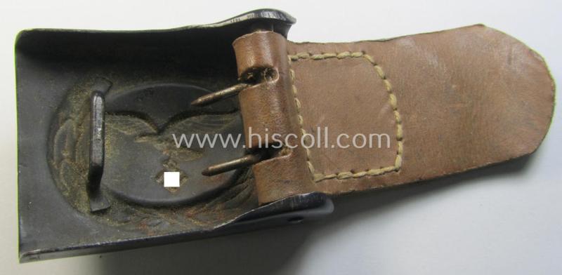 WH (Luftwaffe) bluish-grey-coloured, steel-based belt-buckle, being a maker- (ie. 'H. Aurich'-) marked- and/or: '1942'-dated example that comes mounted onto its leather-based tab and that comes in a 'virtually mint' condition