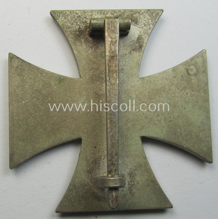 'Eisernes Kreuz 1. Klasse' (ie. Iron Cross 1st class) being an (I deem) mid-war-period produced, neatly maker- (ie. '20'-marked thus by the maker: 'C.F. Zimmermann'-produced) example