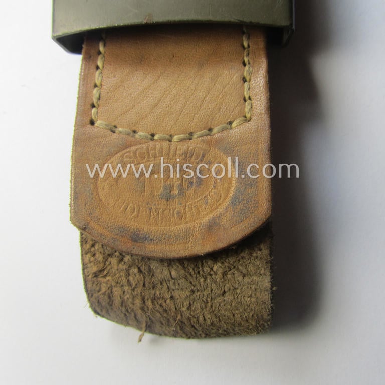 Minimally used, WH (Heeres) field-grey-coloured- and/or steel-based belt-buckle being a clearly maker-marked example that comes mounted onto its maker- (ie. 'E. Schneider - Lüdenscheid'-) marked and/or '1940'-dated leather-based tab