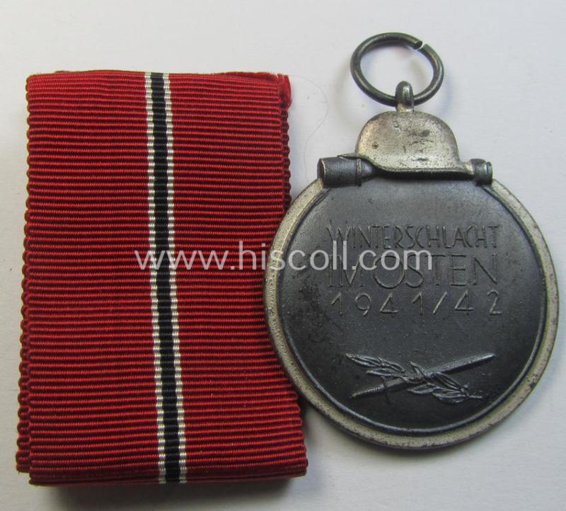 Attractive medal-set: 'Winterschlacht im Osten 1941-42' being a non-maker-marked- (and/or 'Feinzink'-based) specimen and that comes together with its (minimally confectioned) ribbon (ie. 'Bandabschnitt')