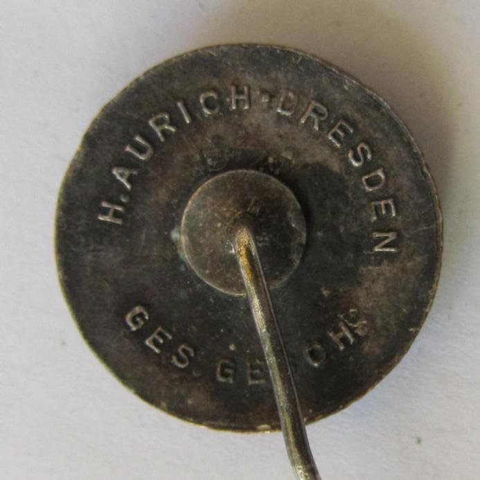 Attractive, semi-enamelled, so-called: RLB- (ie. 'Reichluftschützbund') 'Amtsträgerabzeichen' or: civil-attire badge (of the first pattern), bearing a neat makers-mark ('H. Aurich') and patent-pending- (ie. 'Ges.Gesch.'-) marking on its back