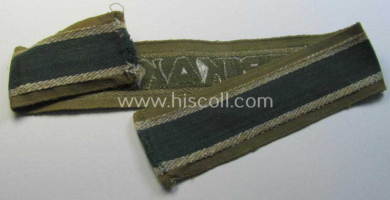 Attractive, 'BeVo'-like cuff-title (ie. 'Ärmelstreifen') entitled: 'Afrikakorps' being a with certainty issued and truly worn example that comes in an overall nice- (ie. minimally shortened-  and/or once tunic-attached-), condition