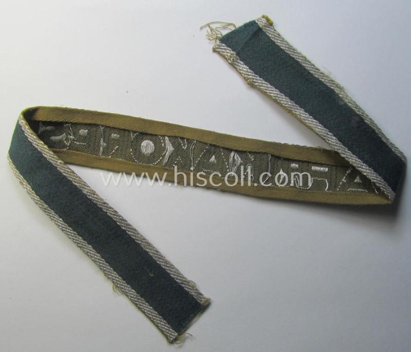 Attractive, 'BeVo'-like cuff-title (ie. 'Ärmelstreifen') entitled: 'Afrikakorps' being a with certainty issued and truly worn example that comes in an overall nice- (ie. minimally shortened- and/or once tunic-attached-), condition