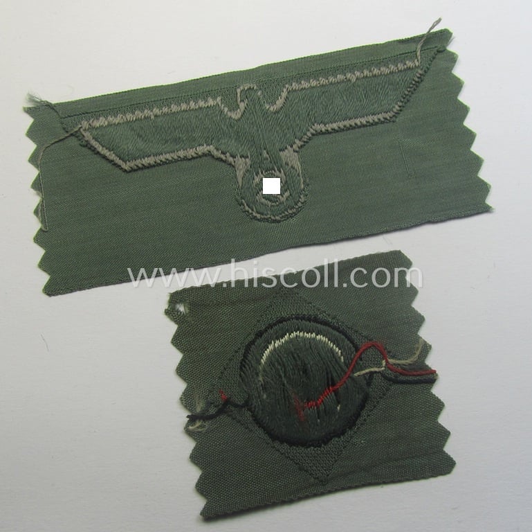 Early- (ie. mid-) war-period, WH (Heeres) cap-eagle & cocarde-set (ie. 'Schiffchenmützen-Adler u. Kokarde-Satz für Mannschaften u. Uffz.') being a 'virtually mint' set as executed in bluish-grey-coloured linnen on a field-grey-coloured background