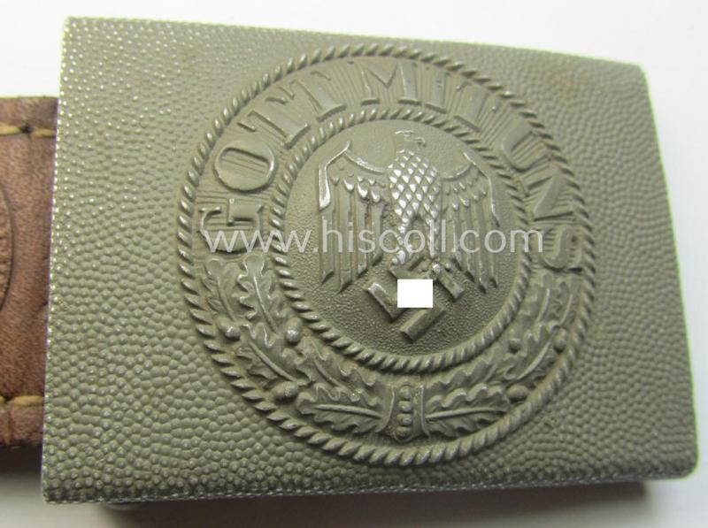 WH (Heeres) 'standard-issue'-pattern, field-grey-toned- and aluminium-based belt-buckle being a maker- (ie. 'G. Brehmer'-) marked- and/or: '1938'-dated example onto its leather-based tab