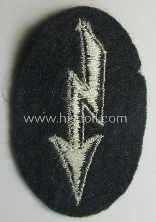 WH (Heeres) trade- and/or special-career-insignia ie. machine-embroidered 'signal-blitz' as executed in black-coloured (and white-piped) linnen on darker-green background as was specifically intended for a soldier within the: 'Pionier-Truppen'