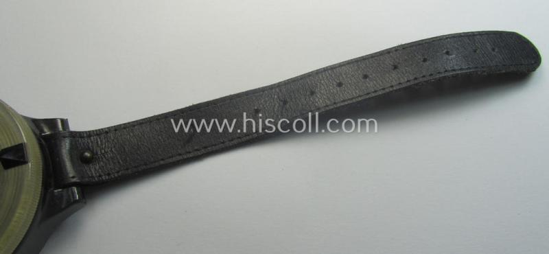 Attractive - and/or fully functional! - example of a WH (Luftwaffe) black-coloured- and/or resin-based, pilots'-armband-compass of the type: 'AK 39' that comes mounted onto its period, bluish-black-coloured strap as issued and/or used