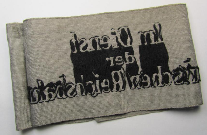 Attractive - and scarcely seen! - example of a DRB- (ie. 'Deutsche Reichsbahn'-) related armband entitled: 'Im Dienst der Deutschen Reichsbahn', being of the 'entirely-woven'-type in a technique similar to the 'BeVo'-weave pattern