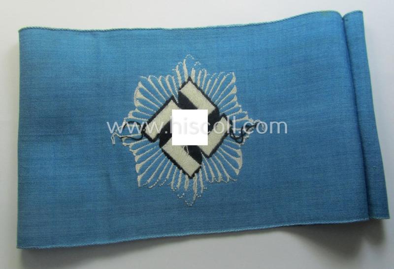Light-blue-coloured and neatly 'BeVo'-woven, so-called: RLB (or: 'Reichsluftschutzbund') 'Amtsträger'-armband depicting the typical 'RLB'-logo (without lettering) and showing an interwoven makers'-designation (ie. 'BeVo - Wuppertal')