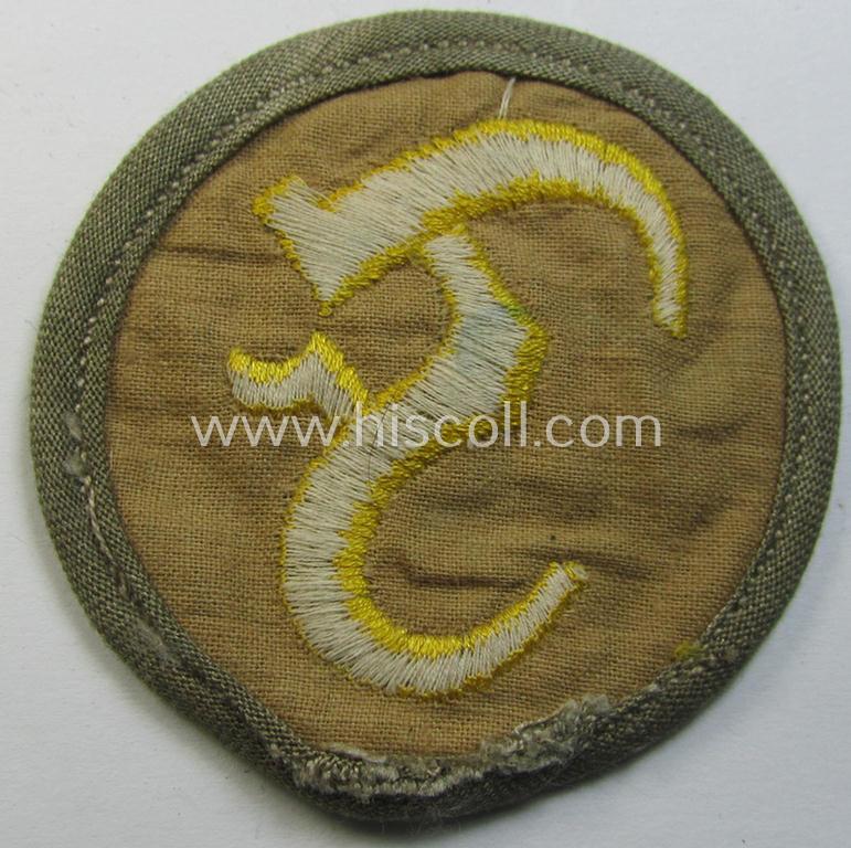 Attractive, WH (Heeres) 'tropical'-issue, so-called: trade- and/or special career-insignia (or machine-embroidered speciality arm-patch) as was intended for a: 'Feuerwerker' (or: artician ie. exposives orderly)