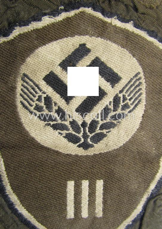 Female-related, enlisted- (ie. NCO-) pattern-, so-called: 'RADwJ'-sleeve-badge (ie. 'Abzeichen des Reichsarbeitsdienst der weiblichen Jugend') being a clearly worn example as executed in the neat 'BeVo'-weave-pattern