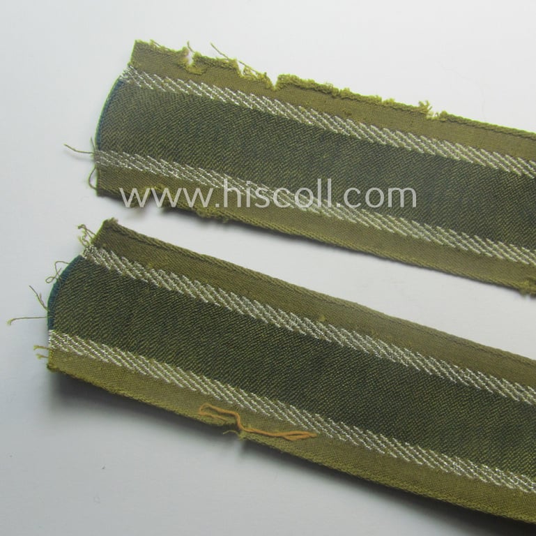 Truly worn, 'BeVo'-like cuff-title (ie. 'Ärmelstreifen') entitled: 'Afrikakorps' being a with certainty issued example that comes in an overall nice- (ie. hardly shortened- and/or once tunic-attached-), condition