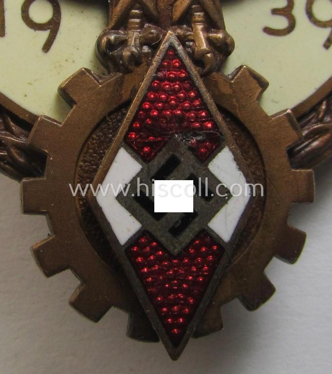 'HJ'- ('Hitlerjugend') ie. 'BDM'- ('Bund Deutscher Mädel') related: 'Reichsberufswettkampf-Siegerabzeichen' (of the 2nd model) entitled: 'Kreissieger 1939' and being a neatly maker- (ie.: 'Ferd. Wagner'-) marked example