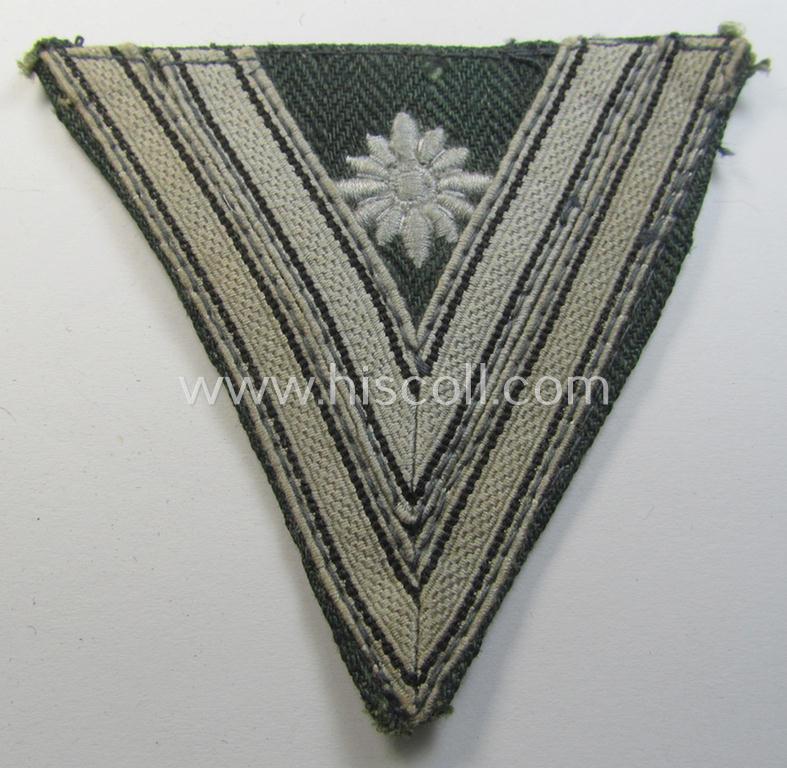 WH (Heeres) 'Armwinkel' (or: arm-chevron) as executed on typical field-grey-coloured wool as was specifically intended for usage by a soldier with the (unusually seen!) rank of: 'Stabsgefreiter'