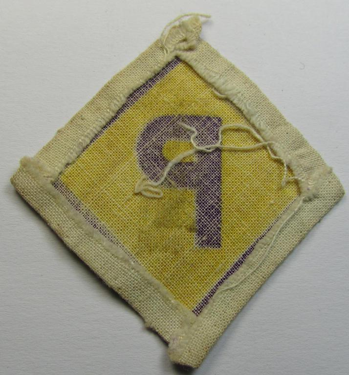 Printed-version of a so-called: Polish forced-labour-breast-patch (ie. 'Brustabzeichen für Poln. Zwangsarbeiter o. Fremdarbeiter') being a moderately used example that comes in a nicely confectioned ie. pre-folded condition
