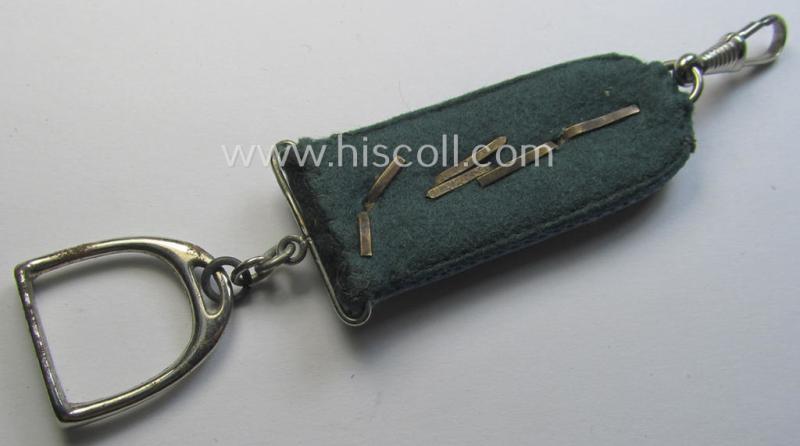 WH (Heeres) 'Nachschub'-related item: a semi-official, commemorative key-holder (aka: 'Url') depicting a (tiny) 'cyphered' shoulderstrap and chromed stirrup