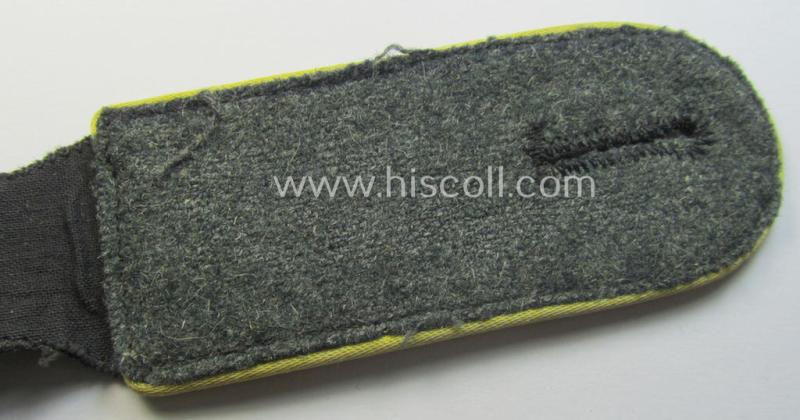 Attractive - albeit regrettably single! - Waffen-SS, EM-type shoulderstrap as piped in the bright-yellow-coloured branchcolour as was intended for usage by an: 'SS-Mann' who served within the: 'SS-Nachrichten-Truppen'