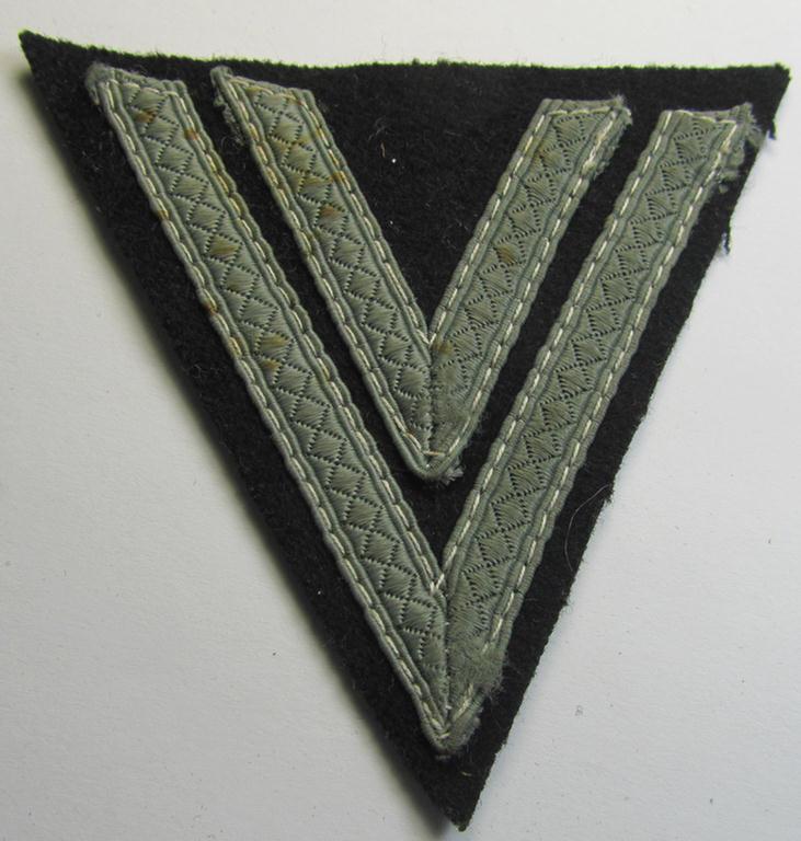 Attractive - and just moderately used! - Waffen-SS- (ie. Heeres Panzer-) type 'Armwinkel' (or: rank-chevron) as executed on black-coloured wool as was intended for an: 'SS-Rottenführer' (ie. 'Obergefreiter')