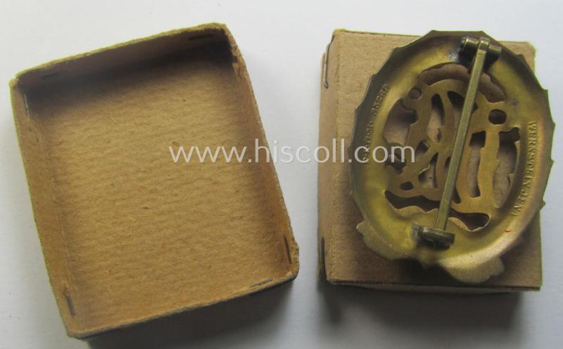 'Reichssportabzeichen DRL in Gold' (or: golden-class DRL sports'-badge) being a truly detailed and/or: maker- (ie. 'Wernstein - Jena'-) marked example that comes stored in its (rare!) period carton-based box