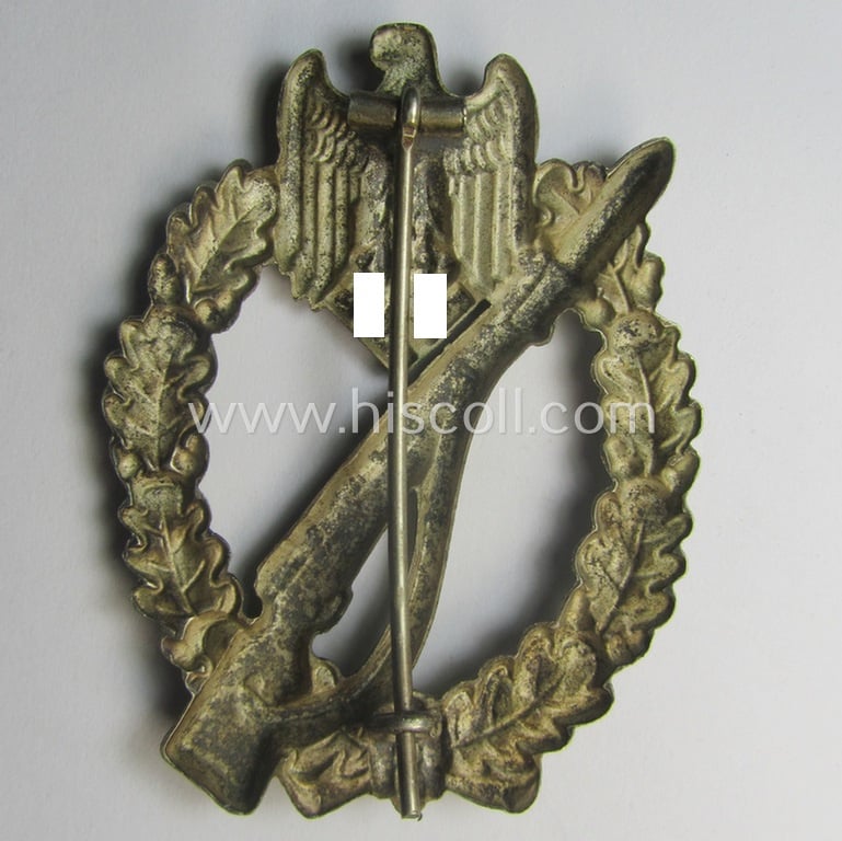 'Infanterie Sturmabzeichen in Silber' (or: silver-class infantry-assault-badge ie. IAB) being a 'Buntmetall'-based example by the: 'Otto Schickle'-company