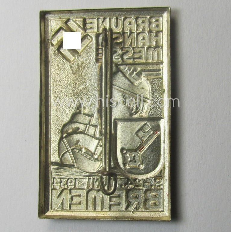 Silver-toned- (ie. I deem 'Feinzink'- ie. pot-metal-) based: N.S.D.A.P.-related day-badge (ie. 'tinnie' or: 'Veranstaltungsabzeichen') entitled: 'Braune Hansa Messe - Bremen - 9.-24. Juni 1934'