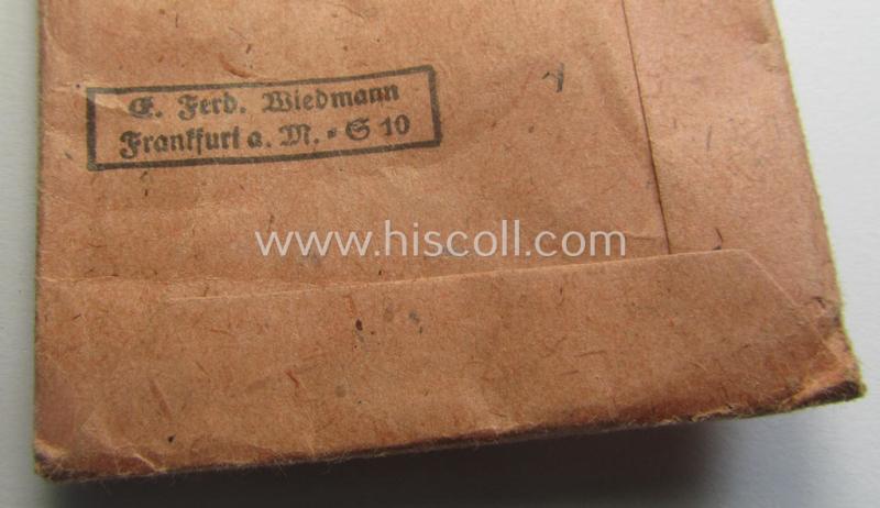 Neatly maker- (ie. '19'-) marked medal: 'Winterschlacht im Osten 1941/42' that came stored in its period pouch by the company: 'E. Ferd. Wiedmann'